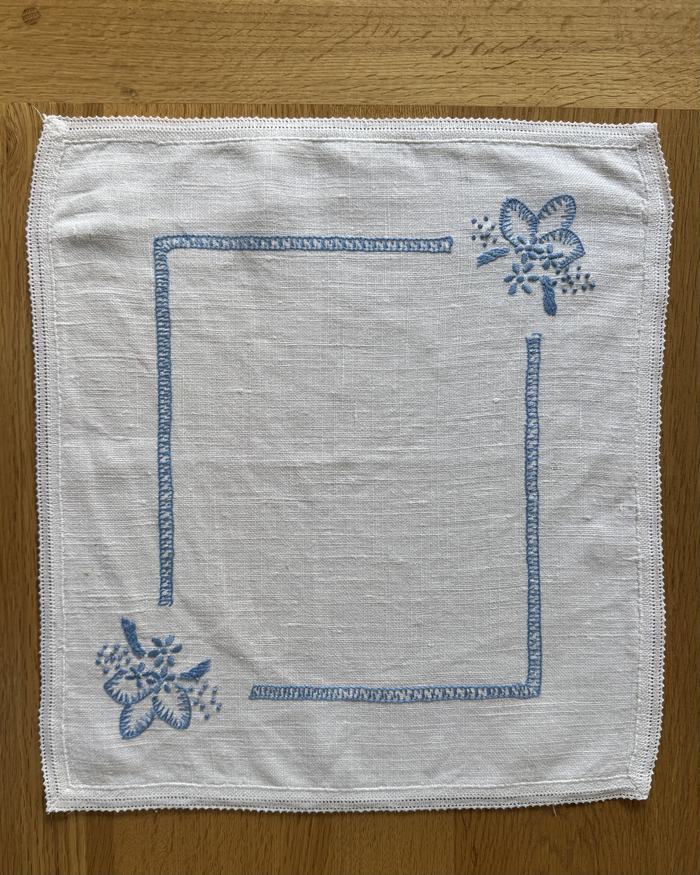 Vintage linen placemat, blue frame and florals